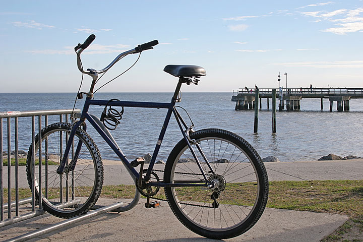 bicycle parked in a bike rack along the Florida coastline