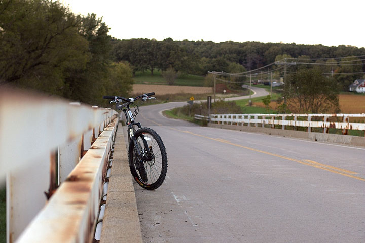 mountain bike parked on a bridge in rural Iowa