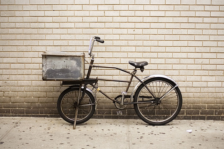 courier bicycle, with brick wall background, in Manhattan, New York City